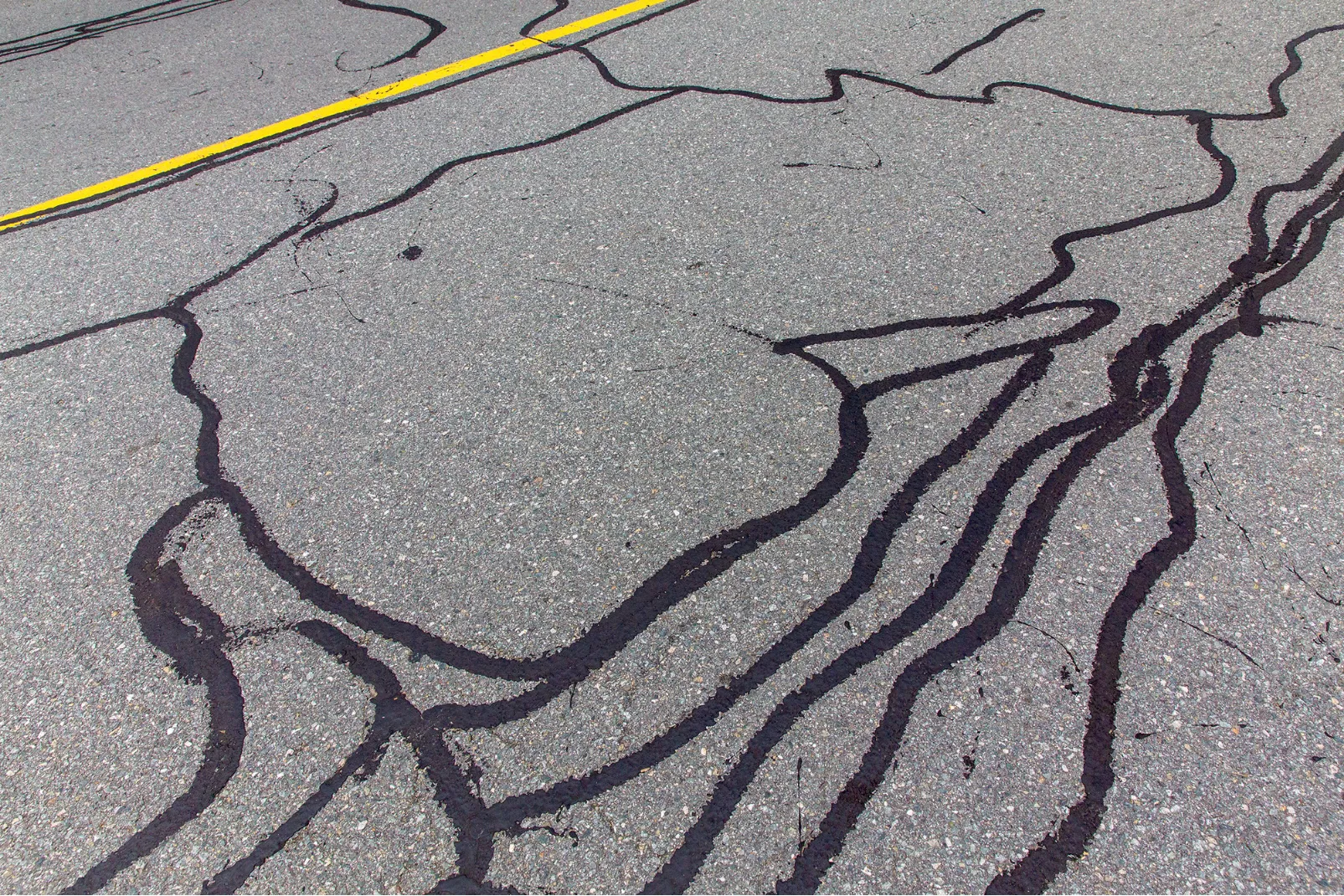 crack-filling-1 A black lines on the pavement.
